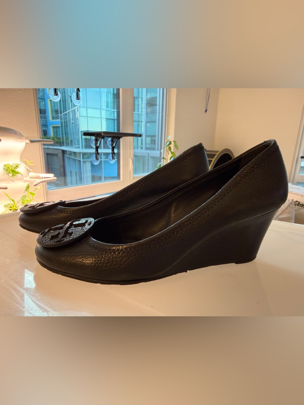 Tory Burch Black Pebbled Leather Wedge Pumps with Logo Emblem